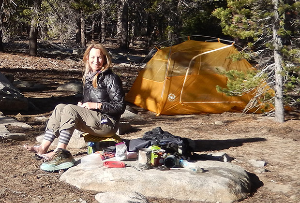 Carla, with her tent behind, at Aqua Bonito campsite.