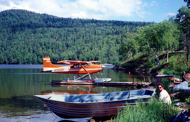 Bryan and a Hudson Air floatplane [Cessna 185] on the lake near Talkeetna