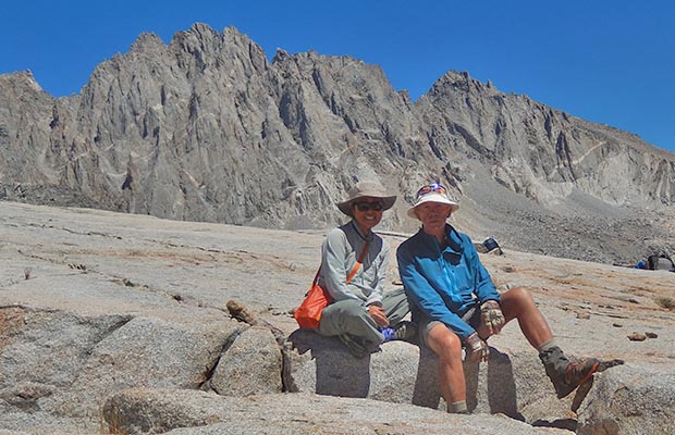 Jeanne and Peter on the summit of Knapsack Pass. Nth Palisade & Polomonium peaks behind