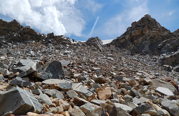 Approaching Hopkins Pass from above the rock buttress.  Loose talus.
