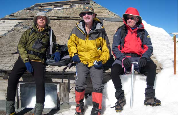 2007: Peter, Mal and Foxie sitting on the fire observation hut at the summit.