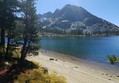 A PCT beach along Dorothy Lake. Forsyth Peak in background.