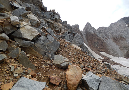 Near the top of Hopkins Pass [11,400'] - a narrow ledge of fractured rock.